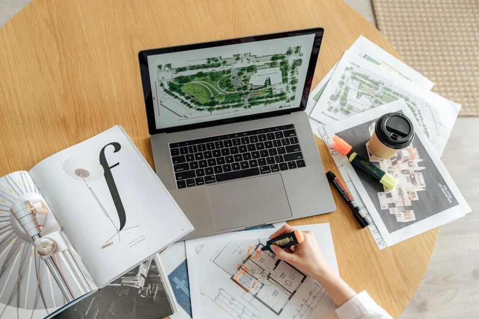 Overhead view of a diverse team collaborating on a project in a modern office setting.
