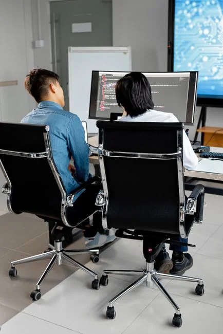 A diverse team engaged in discussion during a collaborative office meeting.